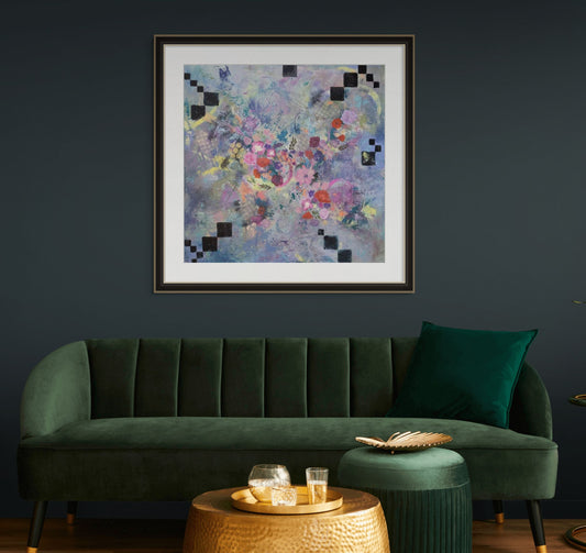 Green sofa in a room with a colorful abstract painting on the wall.