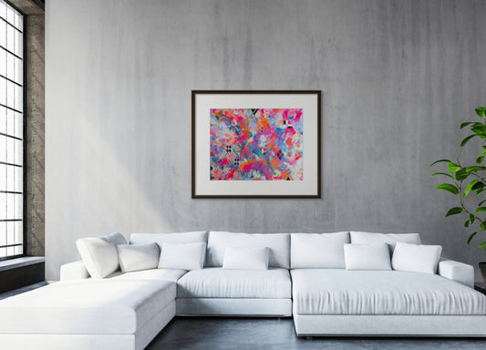 Modern living room with a white sectional sofa and abstract art on the wall.