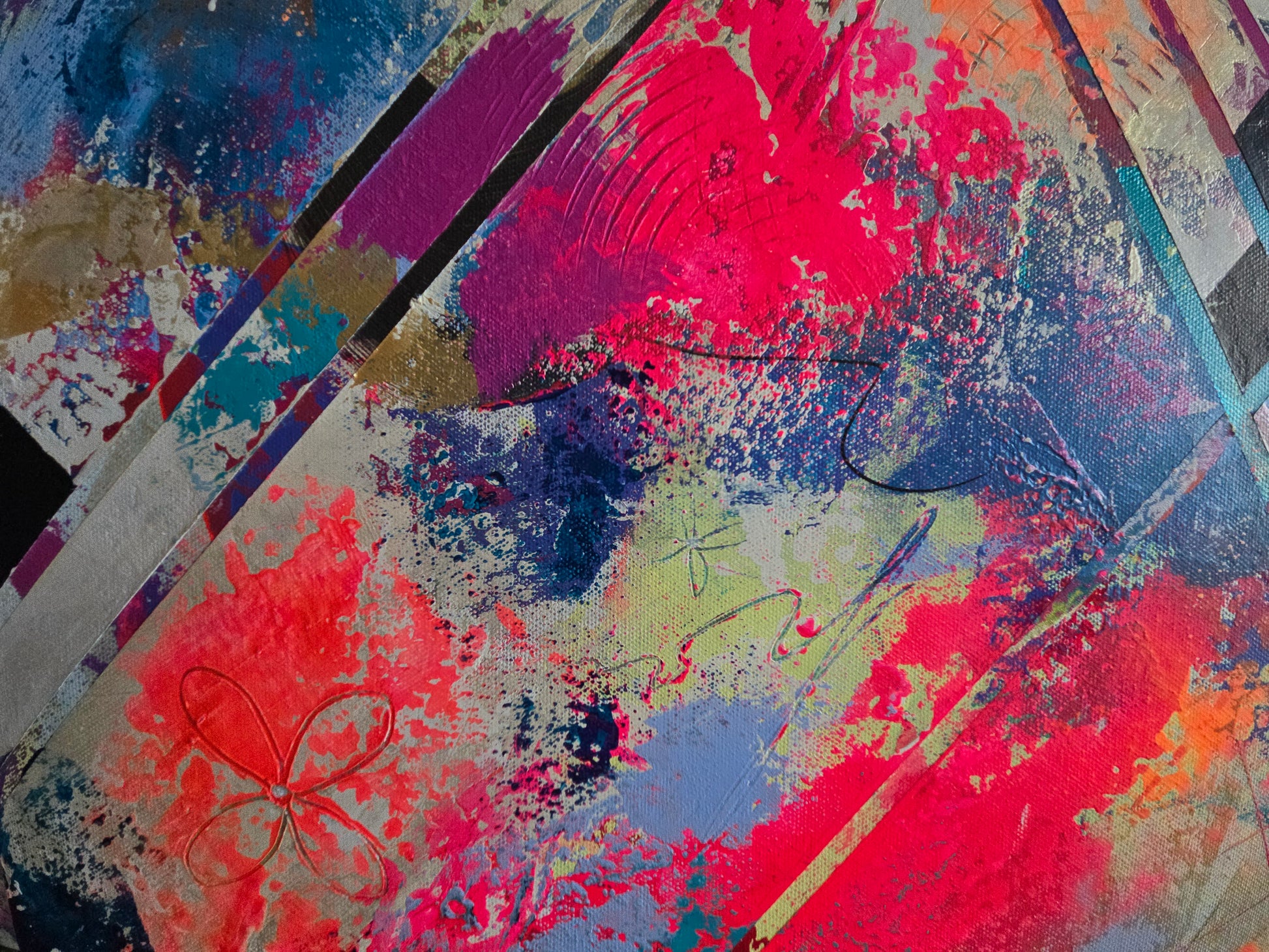 Detail image with splashes of red, blue, and pink with markings on a textured surface.
