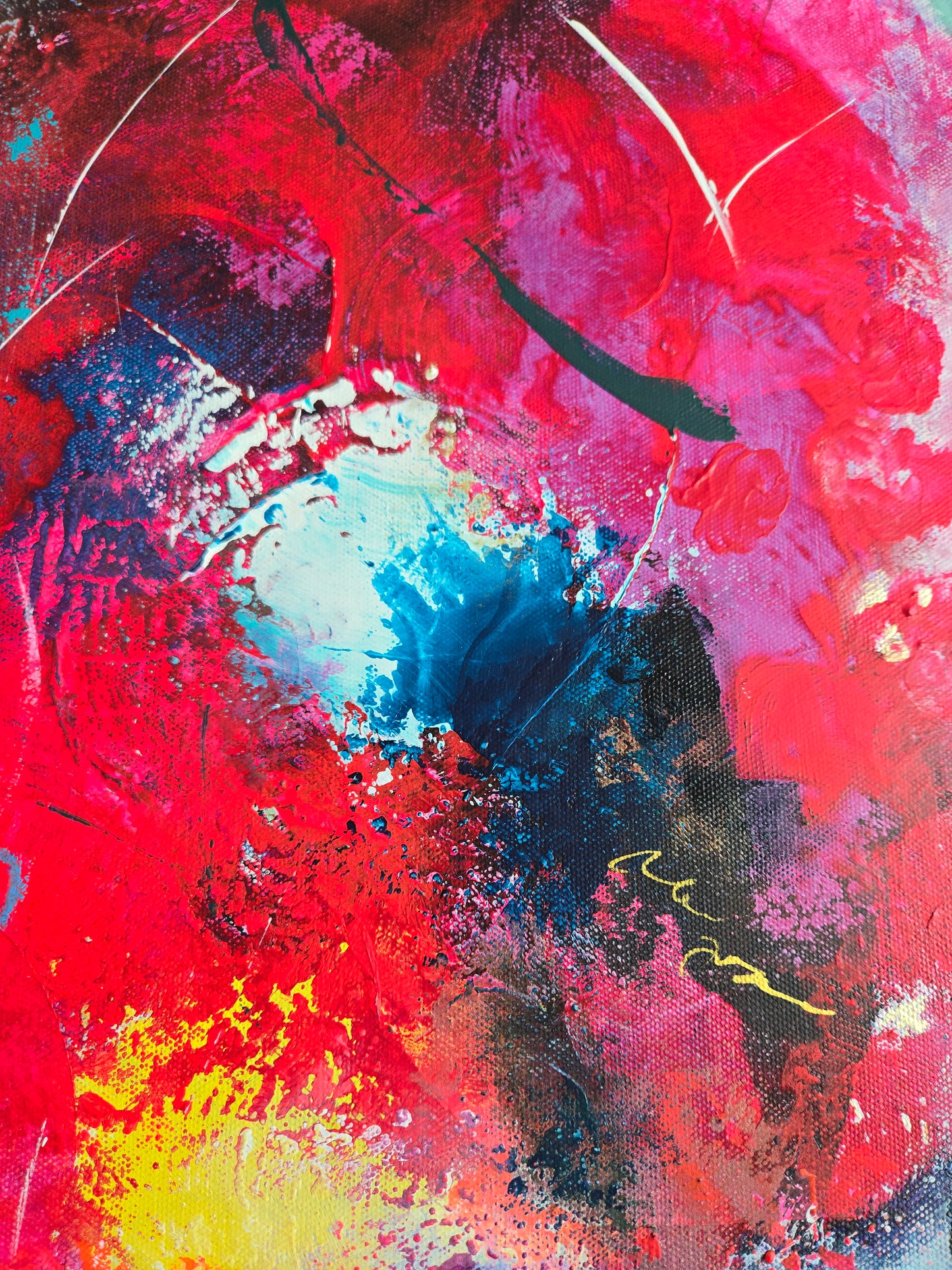 Abstract painting with a mix of red, blue, black, and yellow colors with gold marks.
