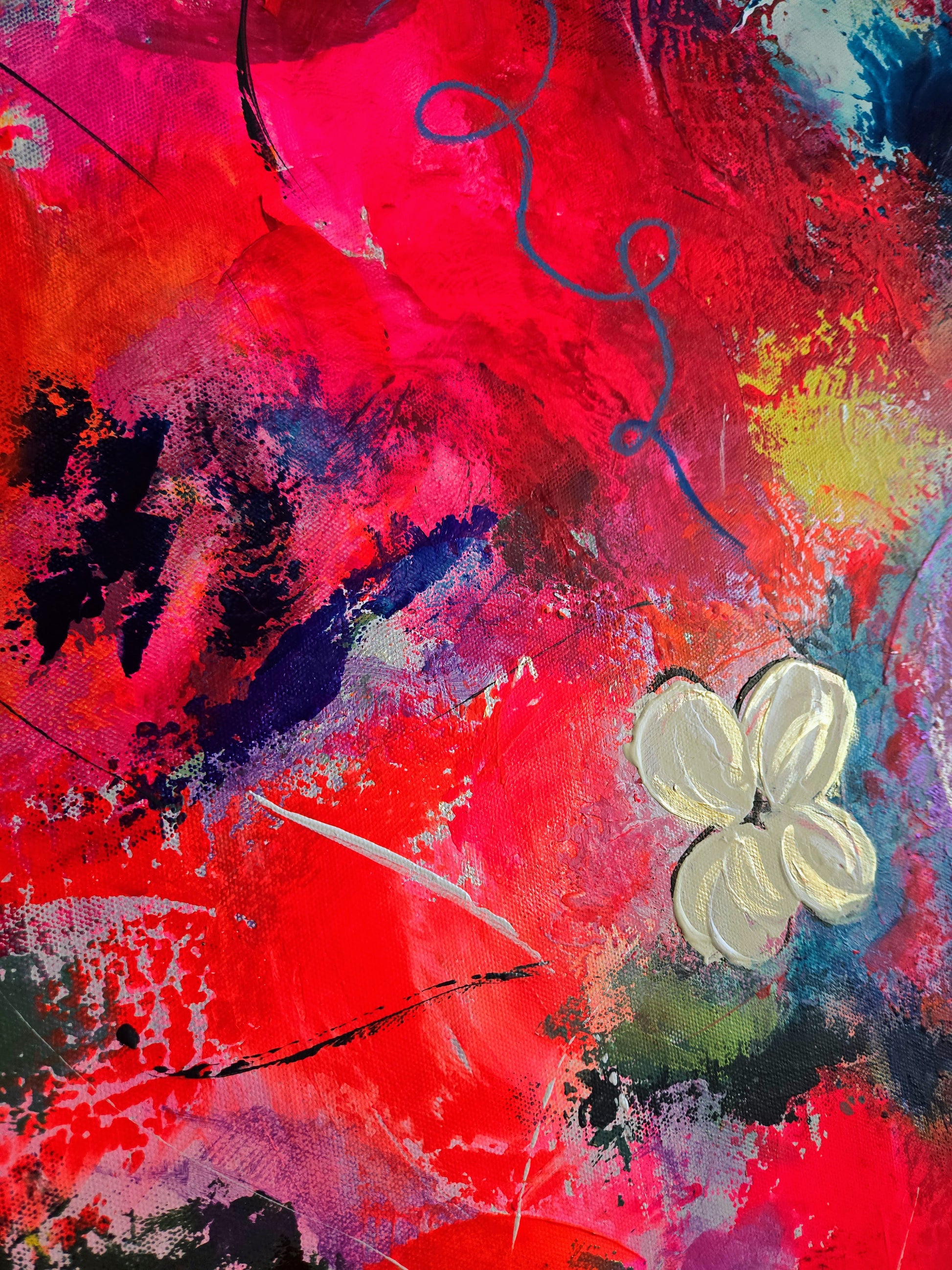Abstract artwork with a white flower on a colorful background